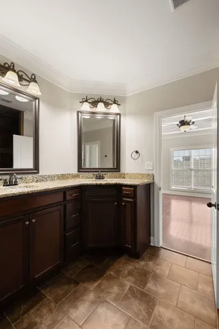 a bathroom with a sink and mirror