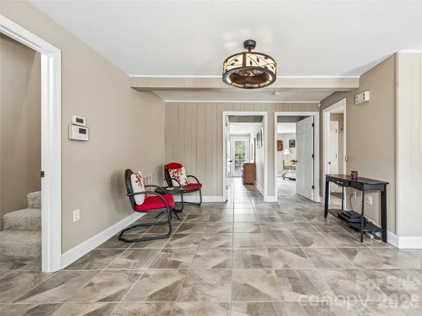 a view of a livingroom with furniture and front door