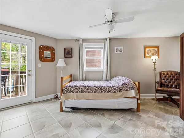 a bedroom with a bed and a chair