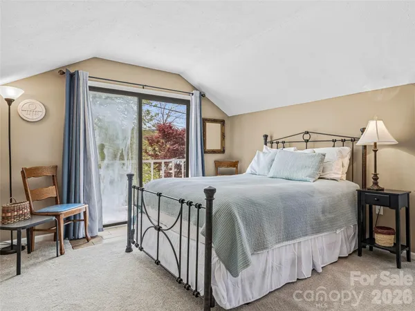 a bedroom with a bed and a table