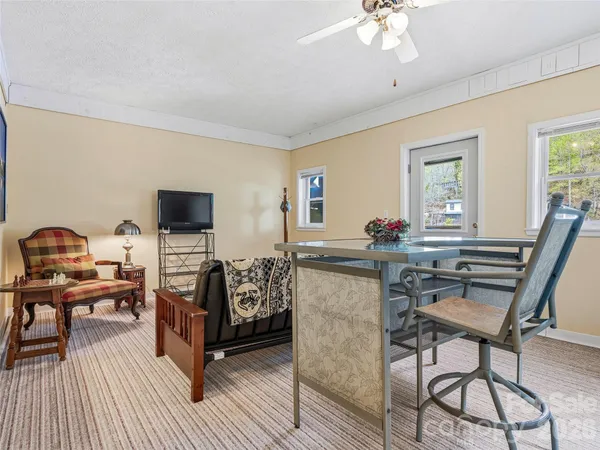 a bed room with furniture and wooden floor