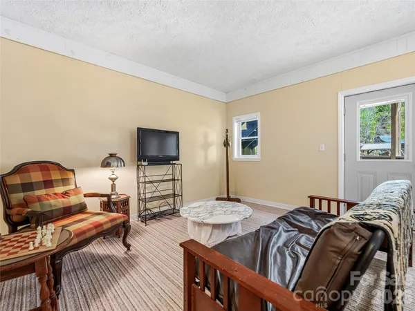 a kitchen with cabinets and window