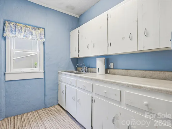 a view of a kitchen from the hallway