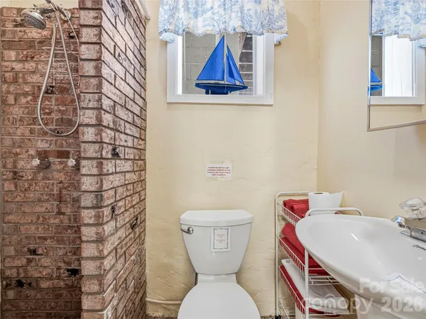 a view of a house with swimming pool and sitting area