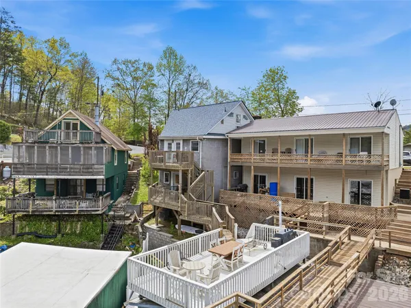 a view of a patio with table and chairs and potted plants