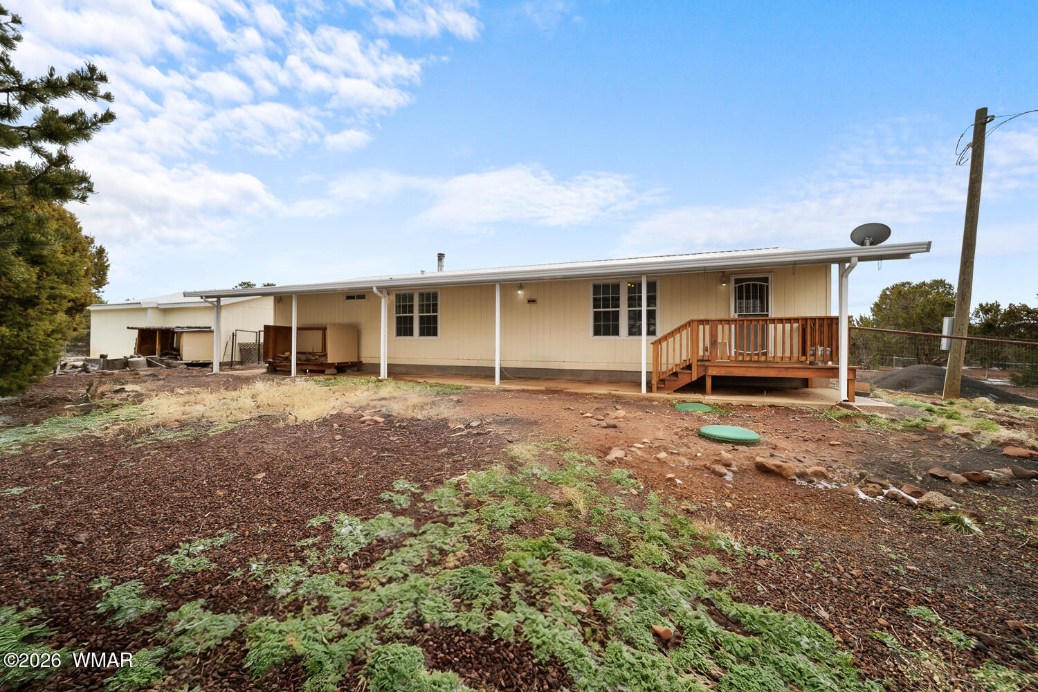 9 N3307 Show Low, AZ 85901 - Photo 12 of 50 a front view of a house with a yard