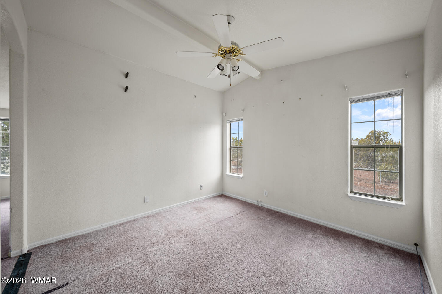 9 N3307 Show Low, AZ 85901 - Photo 34 of 50 an empty room with a window and a ceiling fan
