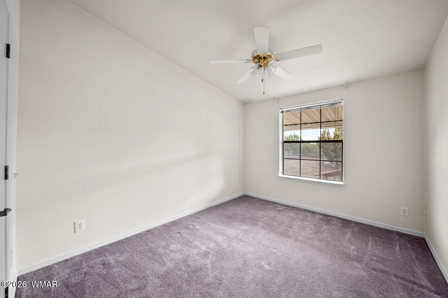 9 N3307 Show Low, AZ 85901 - Photo 44 of 50 an empty room with chandelier fan and windows