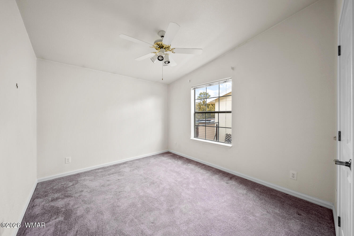 9 N3307 Show Low, AZ 85901 - Photo 45 of 50 an empty room with windows and chandelier fan