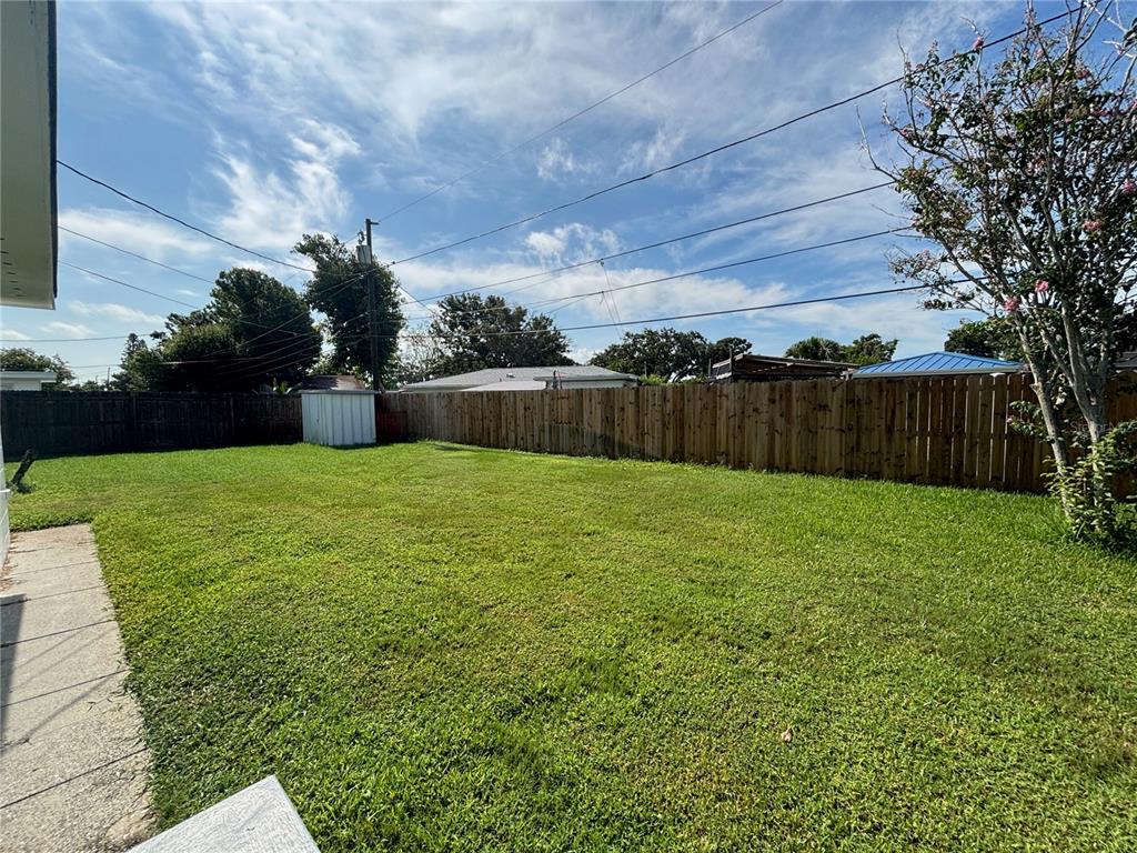 9950 52nd Terrace North St. Petersburg, FL 33708 - Photo 20 of 23 a swimming pool with wooden fence