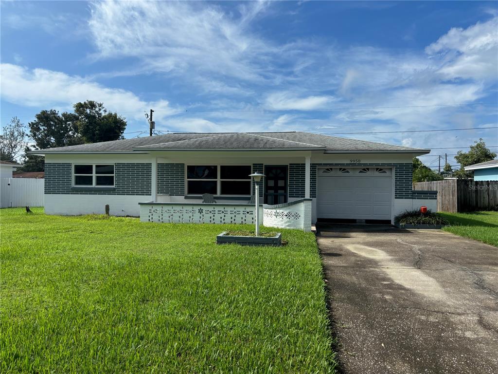 9950 52nd Terrace North St. Petersburg, FL 33708 - Photo 2 of 23 a front view of house with a garden