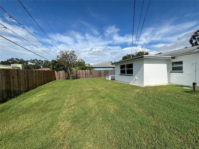 a backyard of a house with a garden