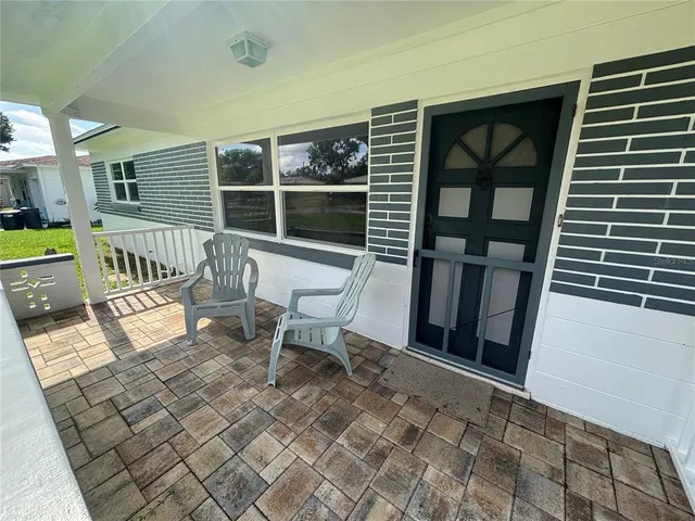 a view of two chairs in the balcony