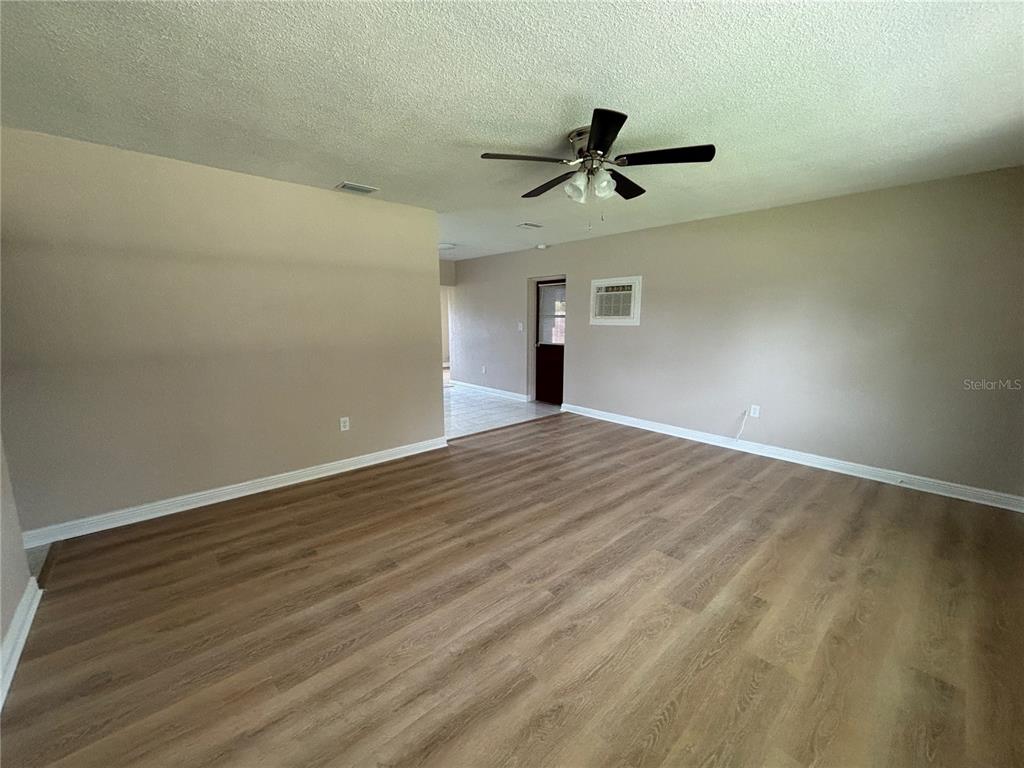 9950 52nd Terrace North St. Petersburg, FL 33708 - Photo 7 of 23 wooden floor in an empty room