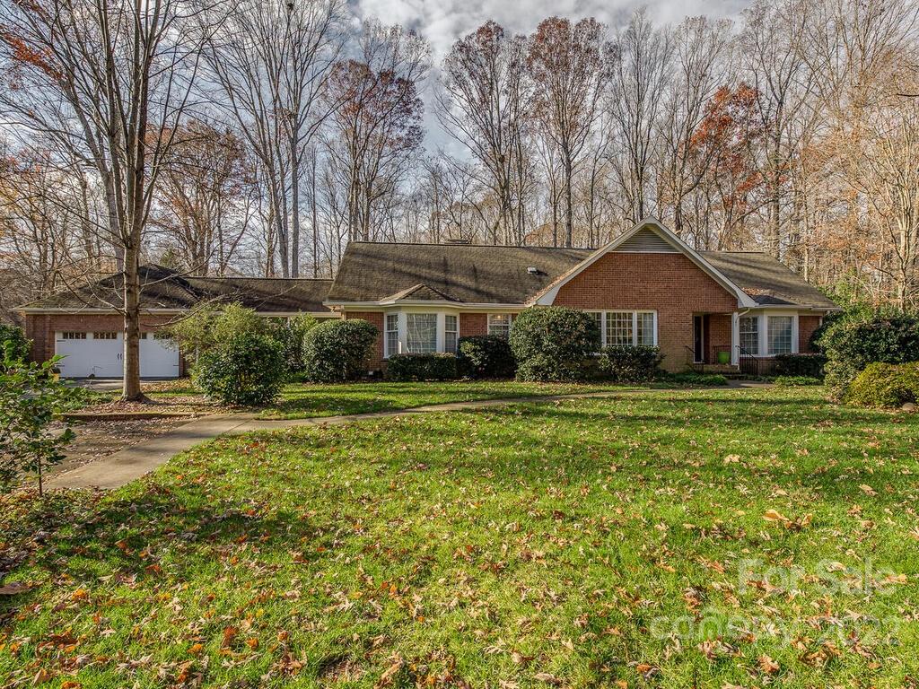 3039 High Ridge Road Charlotte, NC 28270 - Photo 1 of 26 a front view of a house with a yard