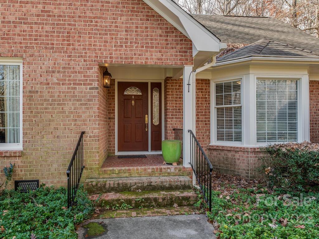 3039 High Ridge Road Charlotte, NC 28270 - Photo 3 of 26 a front view of a house with a garden