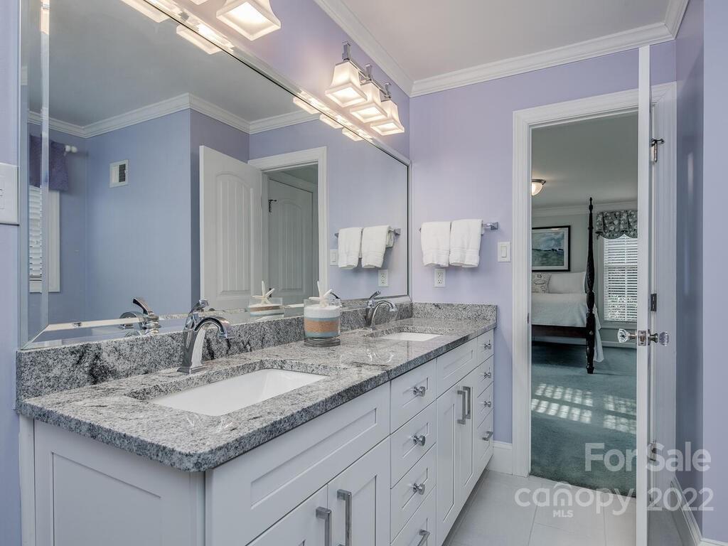 3039 High Ridge Road Charlotte, NC 28270 - Photo 6 of 26 a bathroom with a granite countertop double vanity sink and a mirror