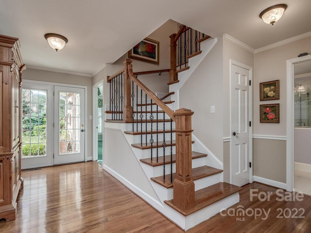 3039 High Ridge Road Charlotte, NC 28270 - Photo 9 of 26 a view of entryway with stairs and wooden floor