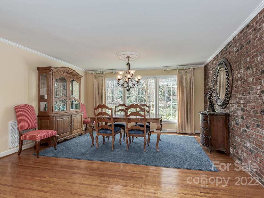 3039 High Ridge Road Charlotte, NC 28270 - Photo 10 of 26 a view of a dining room with furniture window and wooden floor