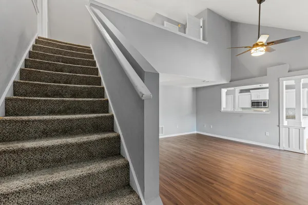 a bathroom with a shower and a toilet