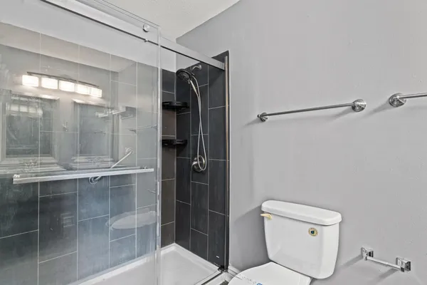 a bathroom with double vanity and a sink