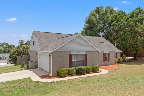 front view of a house with a yard