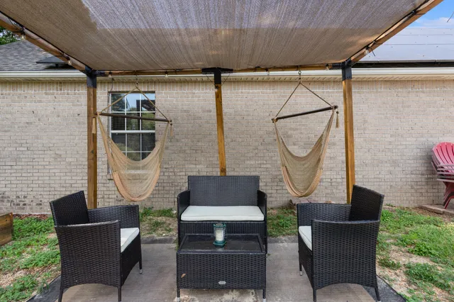 a kitchen with granite countertop a sink and cabinets