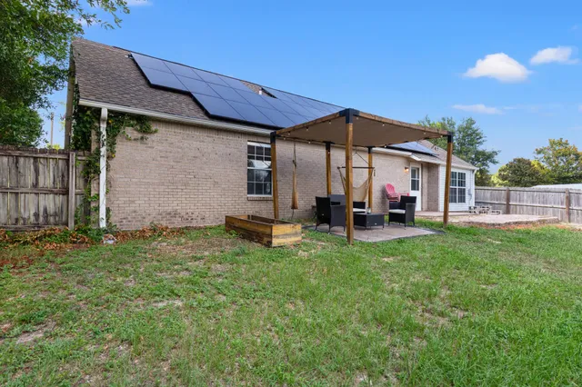 a view of a livingroom with wooden floor and a window