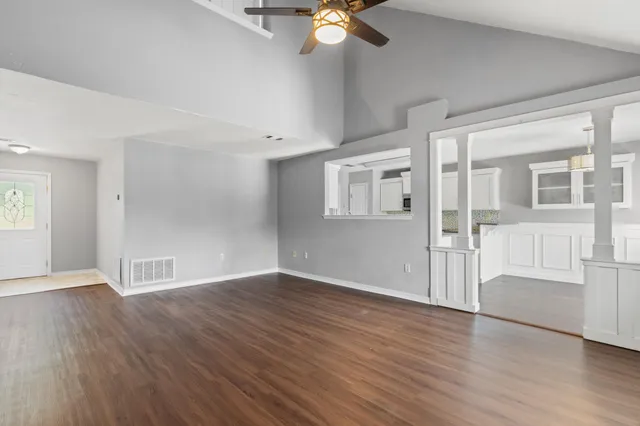wooden floor in an empty room with a window