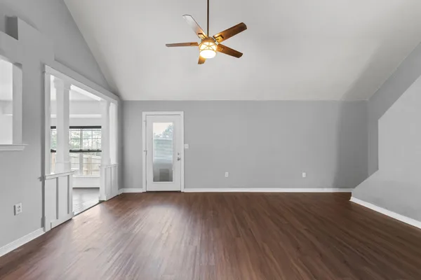 a view of hallway with wooden floor