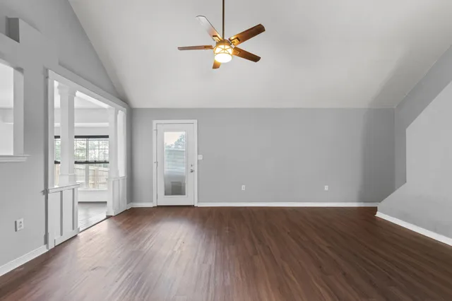 a view of hallway with wooden floor