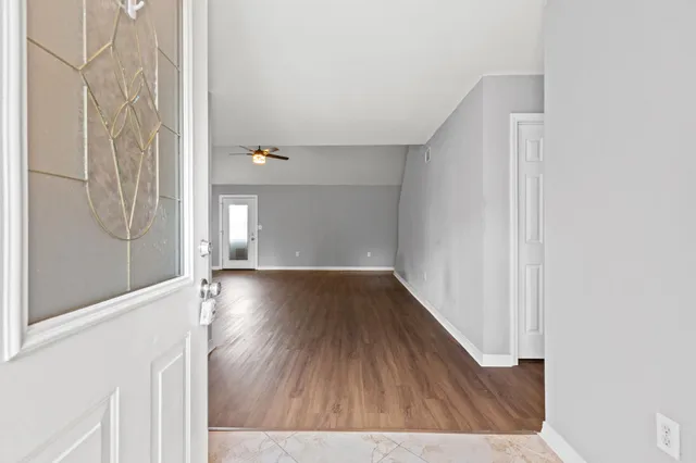 a view of gallery with wooden floor