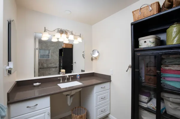a bathroom with a sink double vanity and a mirror