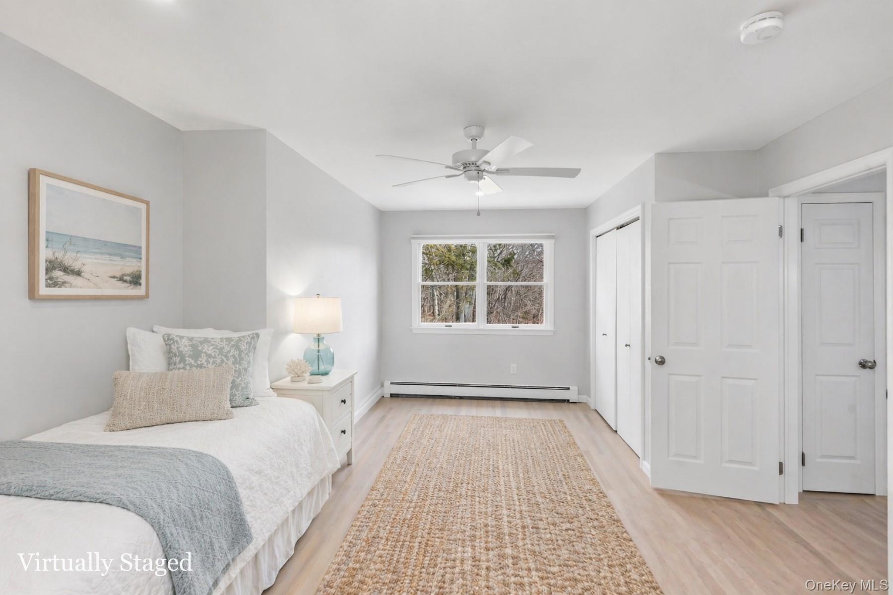 5845 North Bayview Road Southold, NY 11971 - Photo 17 of 26 Second floor bedroom with closet and ample natural light