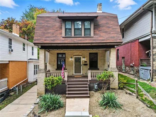 a front view of a house with a porch