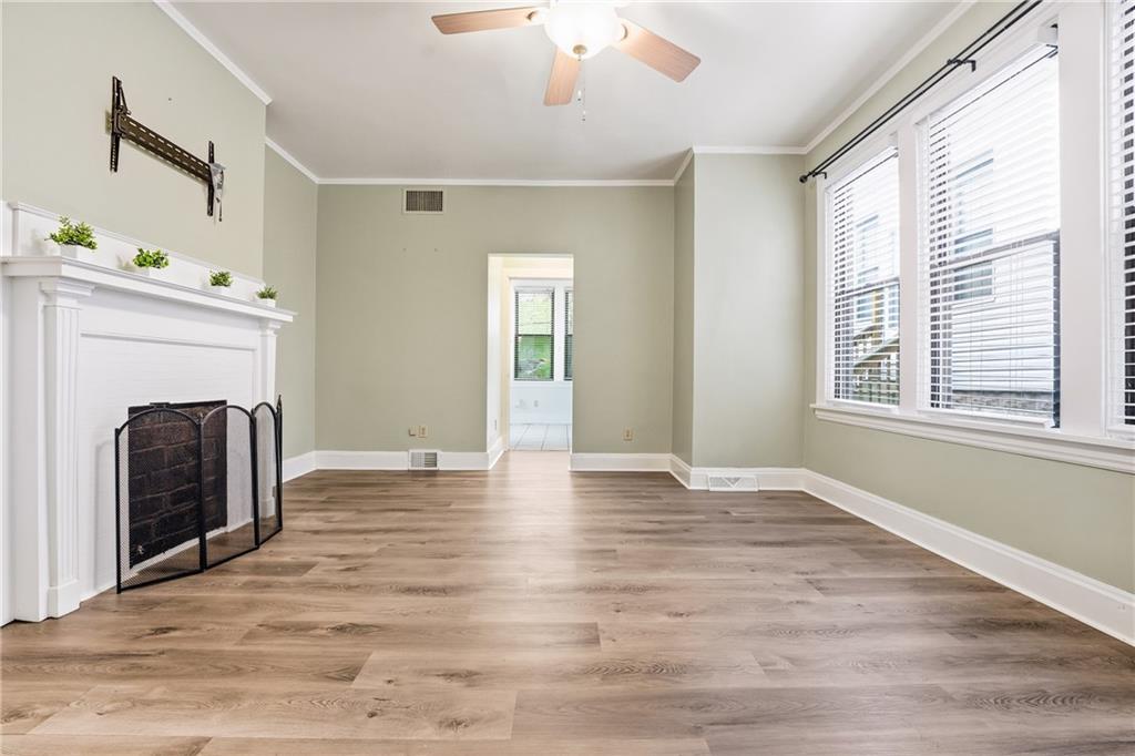 233 South Starr Avenue Pittsburgh, PA 15202 - Photo 18 of 43 a view of an empty room with wooden floor and a window