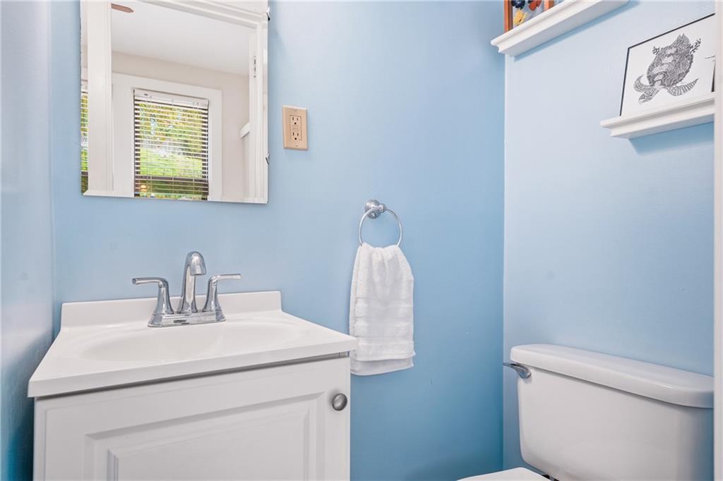233 South Starr Avenue Pittsburgh, PA 15202 - Photo 22 of 43 a bathroom with a sink a toilet and mirror