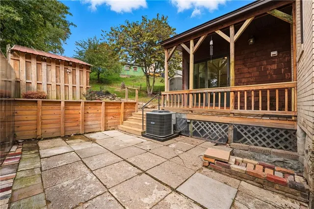 a view of a chair and table in the patio