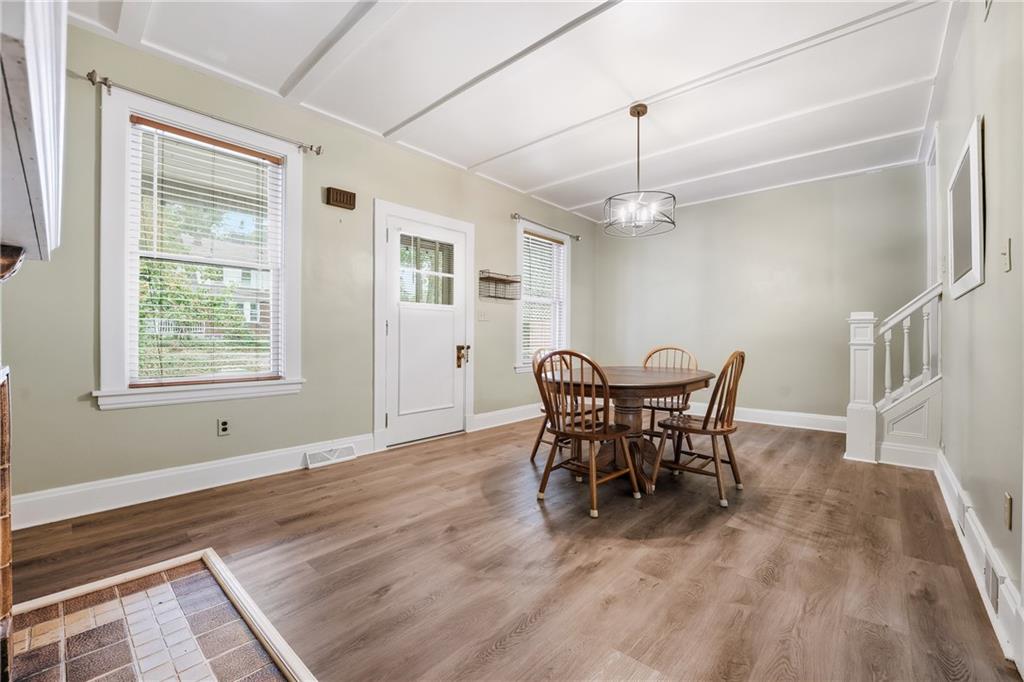 233 South Starr Avenue Pittsburgh, PA 15202 - Photo 7 of 43 a dining room with furniture a chandelier and wooden floor