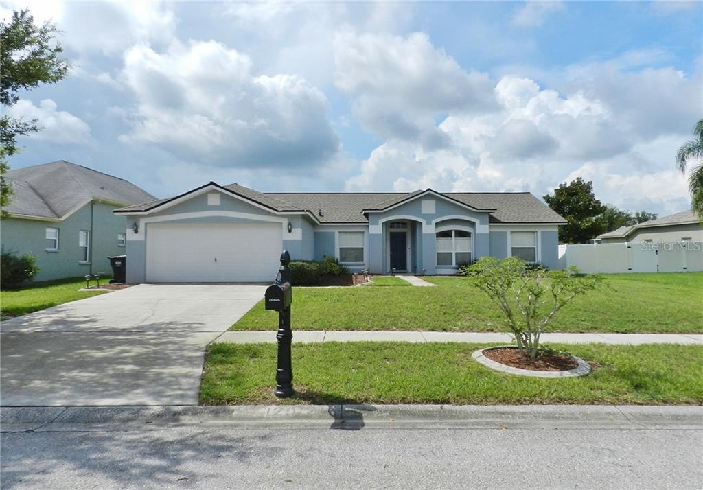 12912 Raysbrook Drive Riverview, FL 33569 - Photo 1 of 1 a front view of a house with a yard and garage