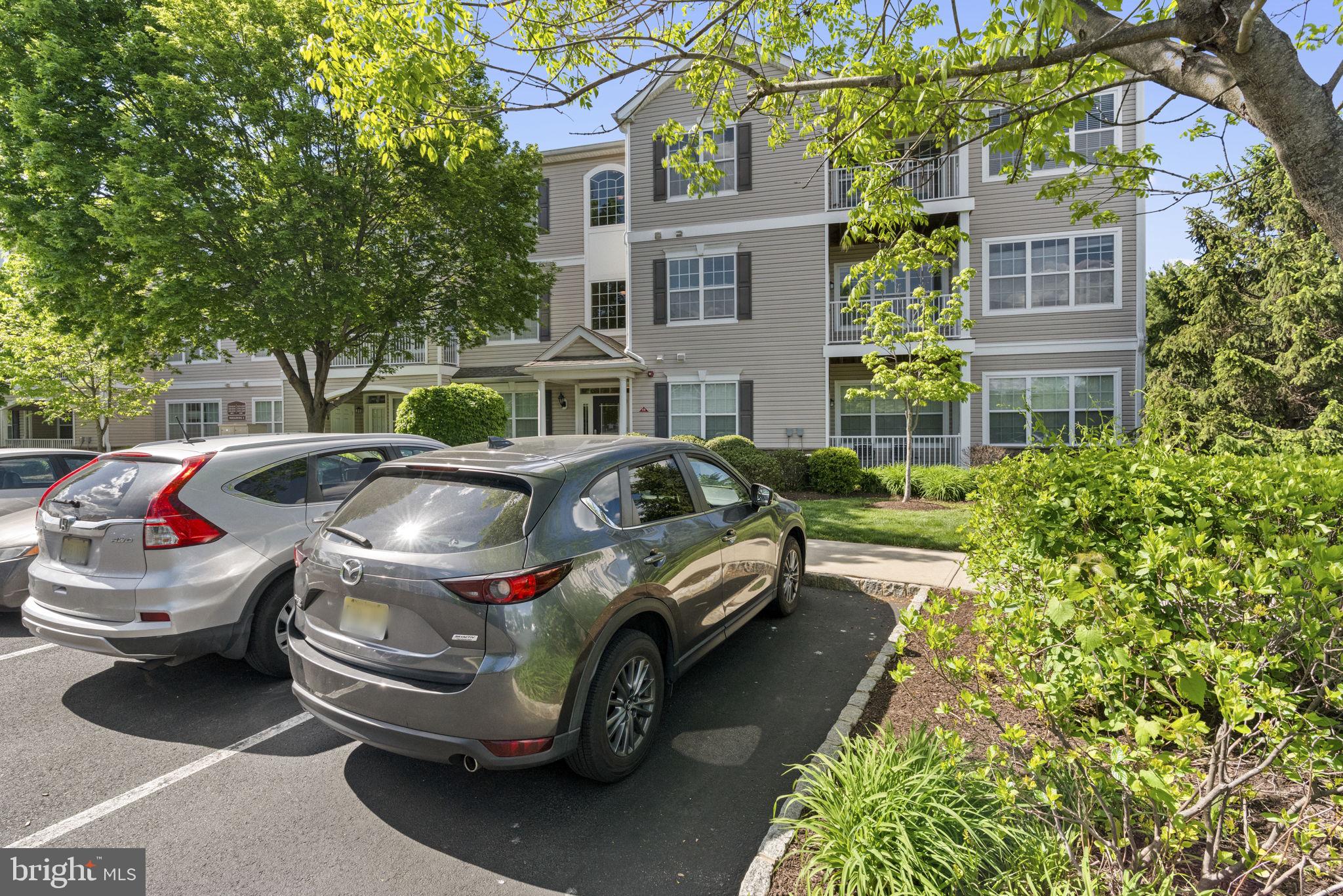 218 Timberlake Drive Ewing, NJ 08618 - Photo 23 of 30 a front view of a house with cars parked