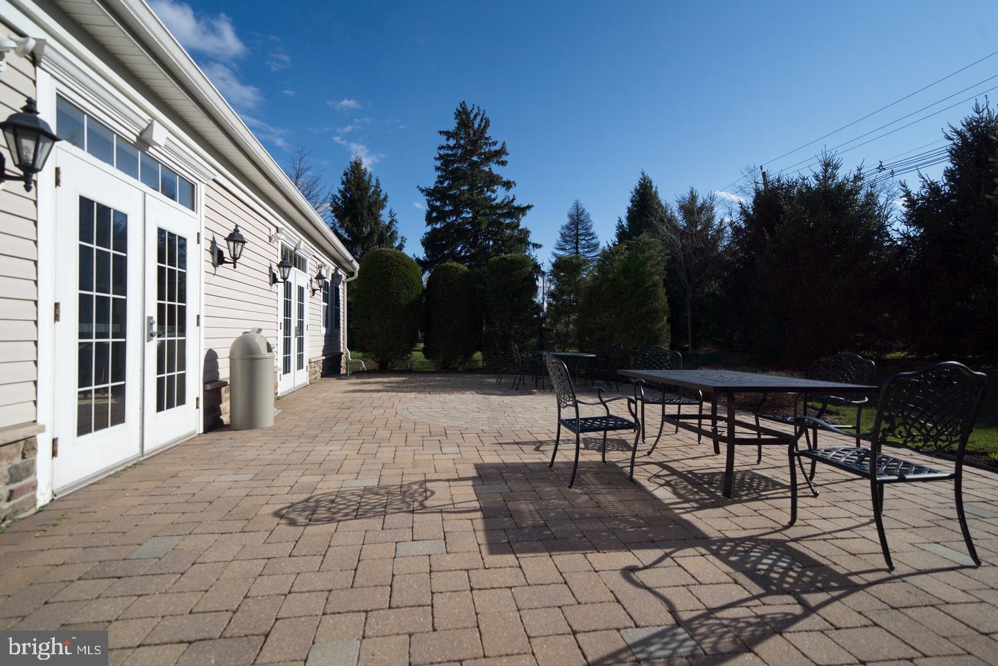 218 Timberlake Drive Ewing, NJ 08618 - Photo 27 of 30 a view of a patio with dining table and chairs with a fire pit