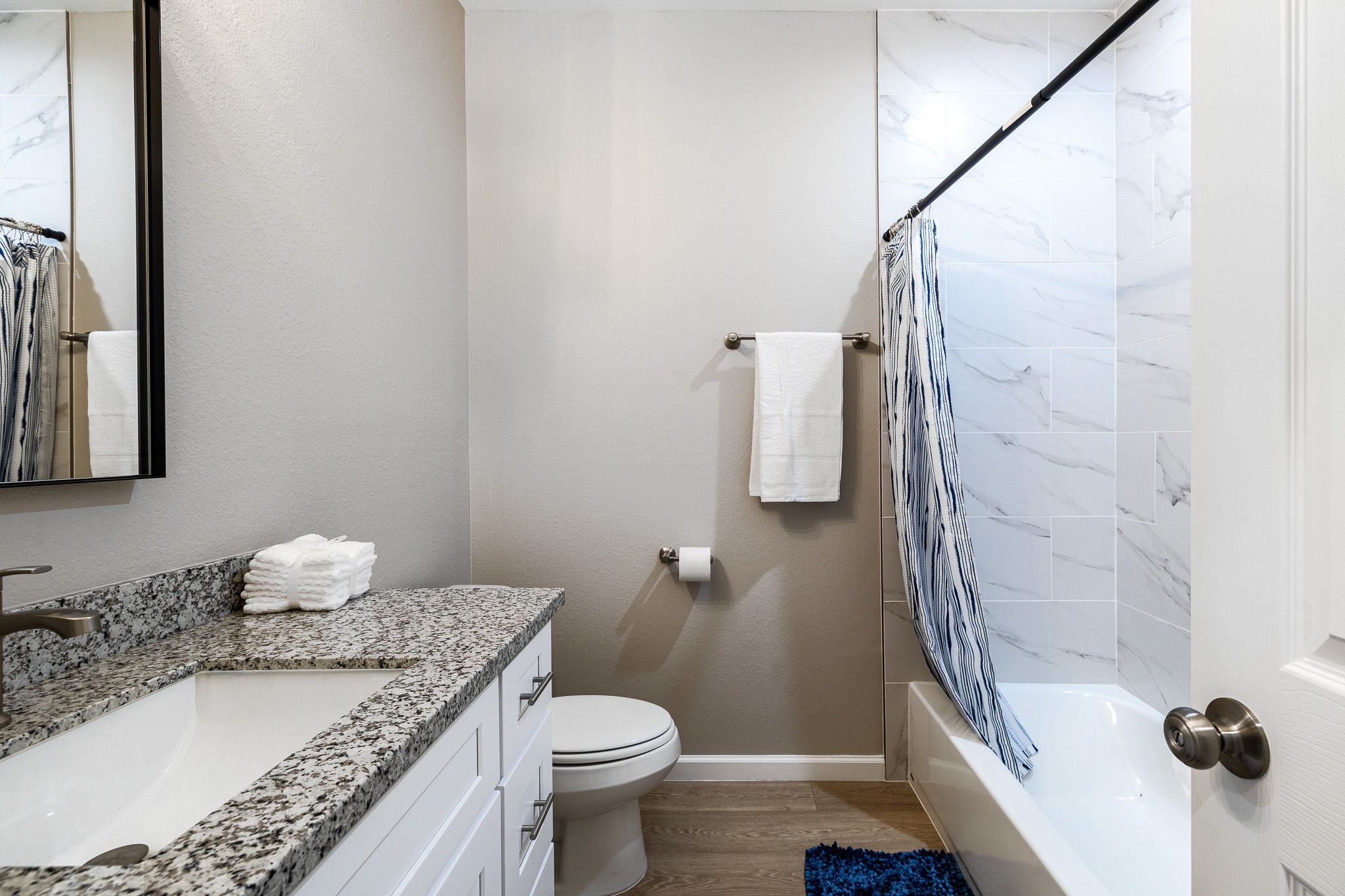 4661 Clover Street, Unit B Houston, TX 77051 - Photo 14 of 26 a bathroom with a granite countertop sink toilet and shower