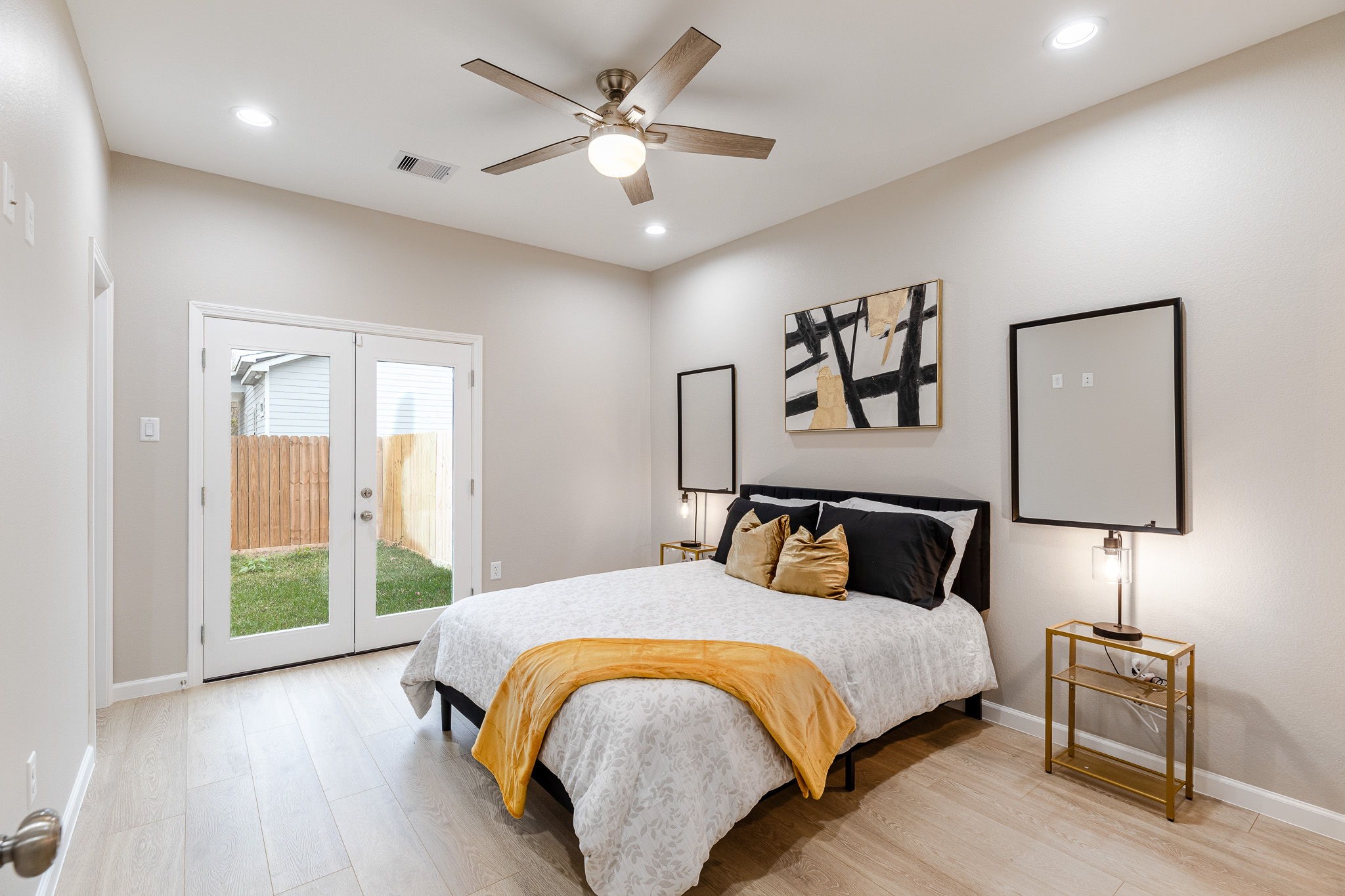 4661 Clover Street, Unit B Houston, TX 77051 - Photo 19 of 26 a bedroom with a large bed and a lamp