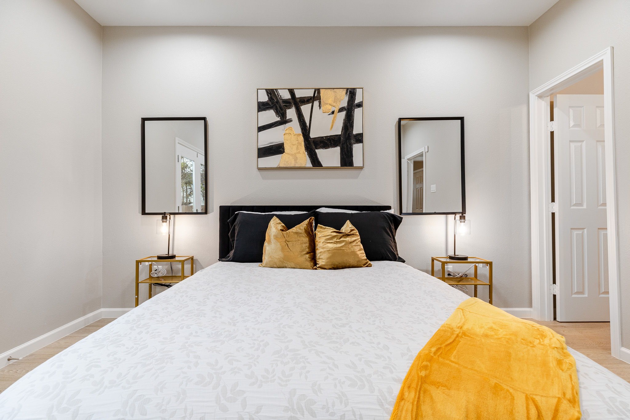 4661 Clover Street, Unit B Houston, TX 77051 - Photo 21 of 26 a bedroom with a bed and painting on the wall