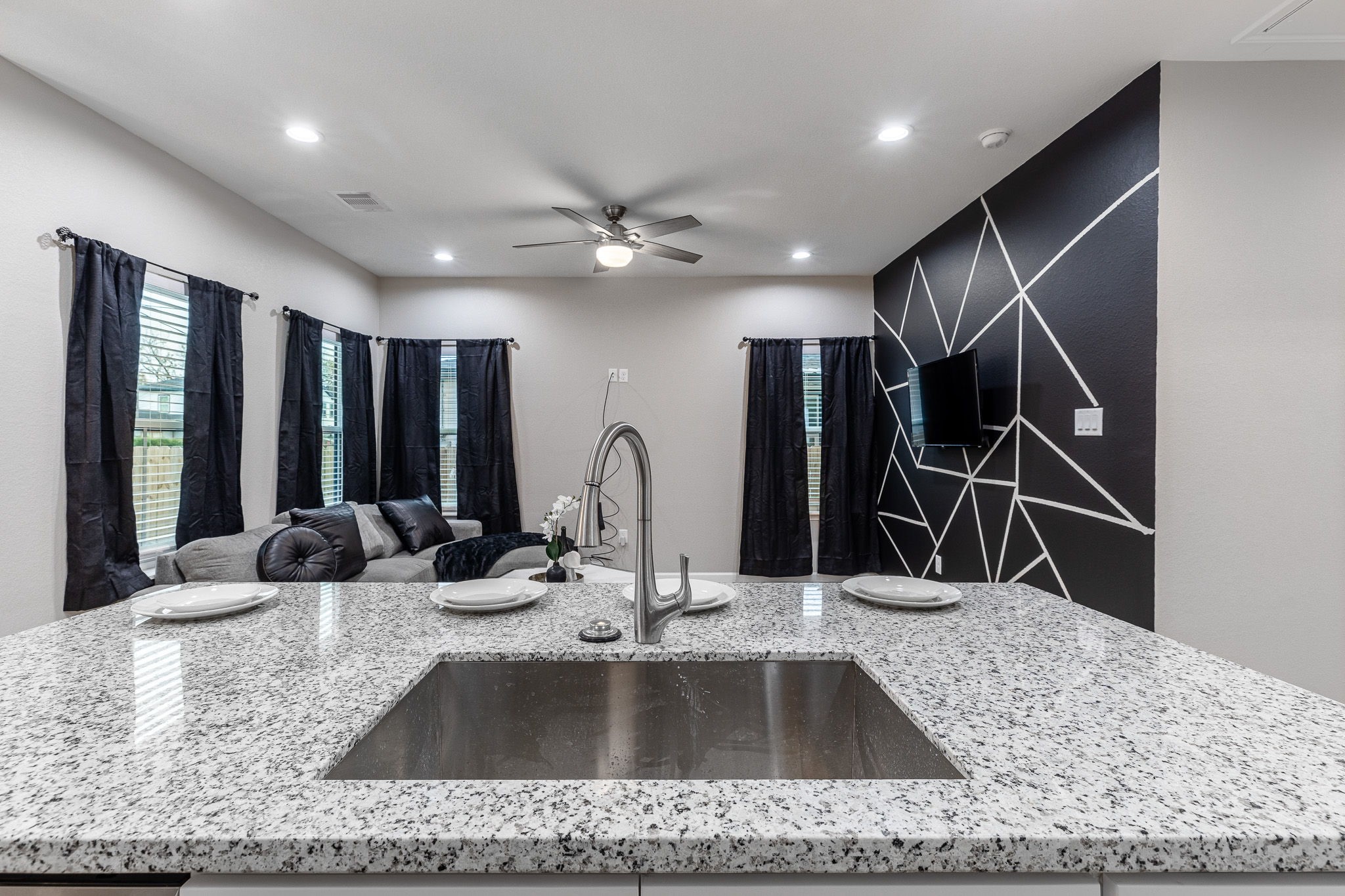 4661 Clover Street, Unit B Houston, TX 77051 - Photo 9 of 26 a kitchen with kitchen island a sink and wooden floor