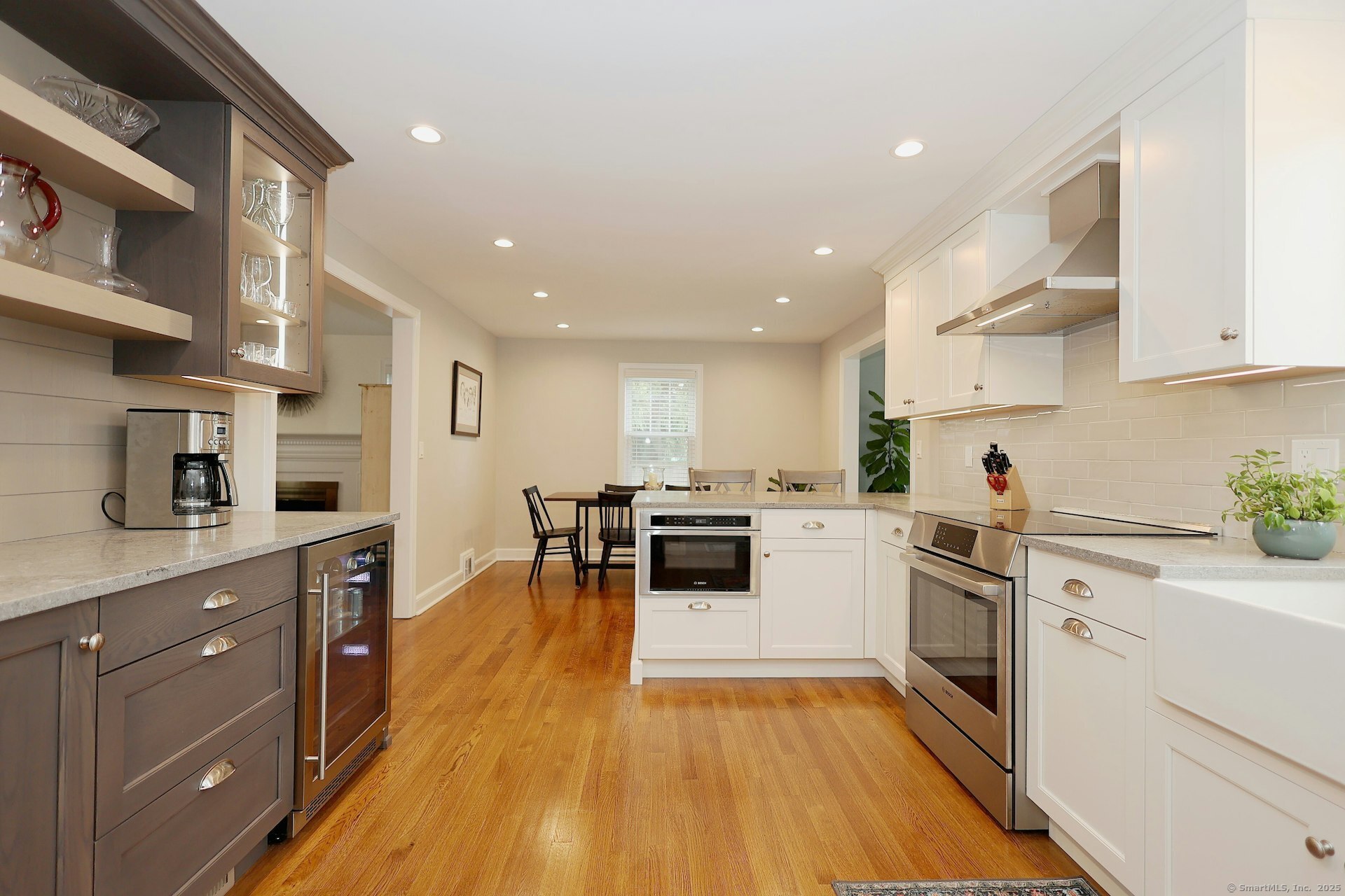 100 Overhill Road Fairfield, CT 06824 - Photo 11 of 40 a kitchen with white cabinets and appliances
