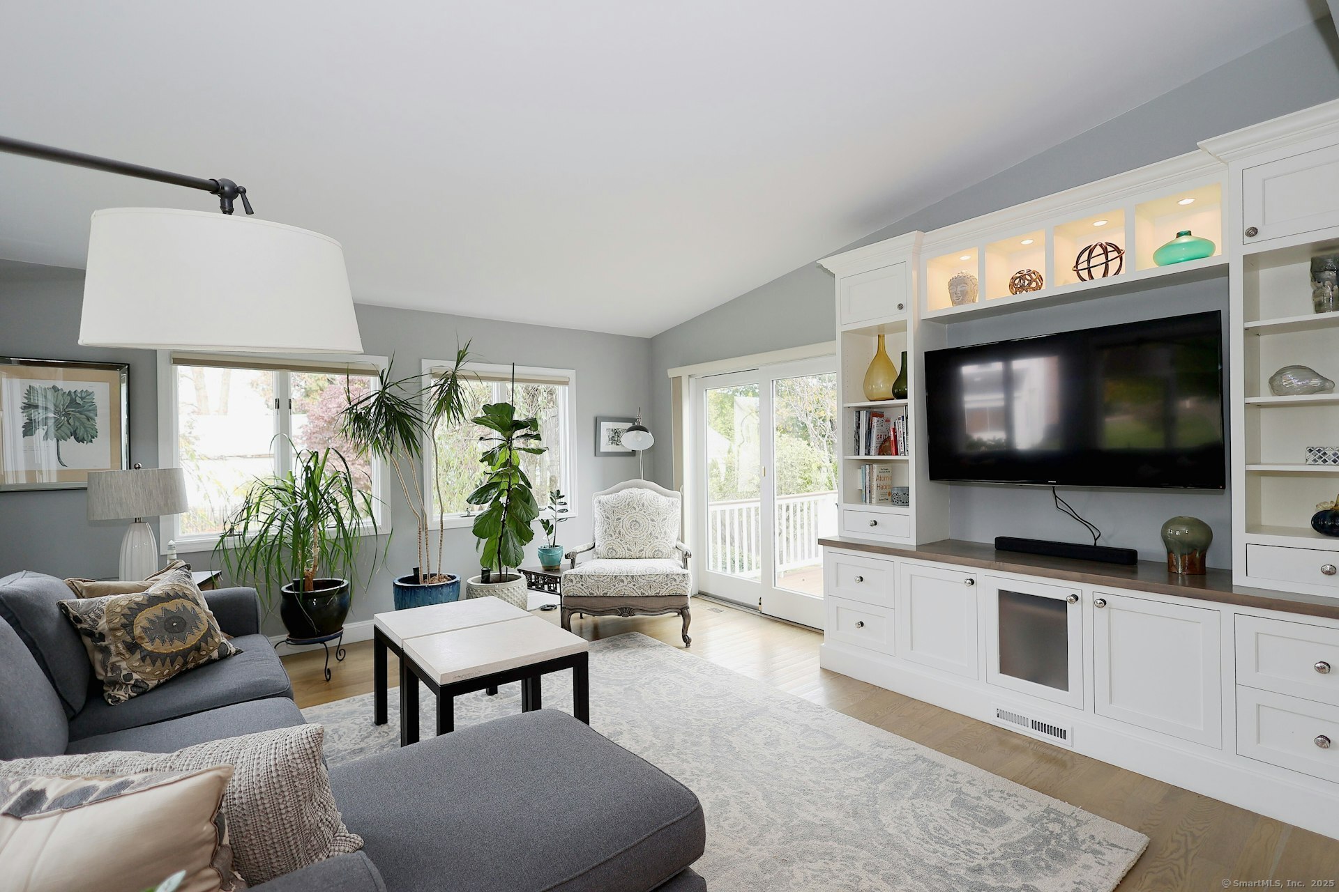 100 Overhill Road Fairfield, CT 06824 - Photo 16 of 40 a living room with furniture and a flat screen tv
