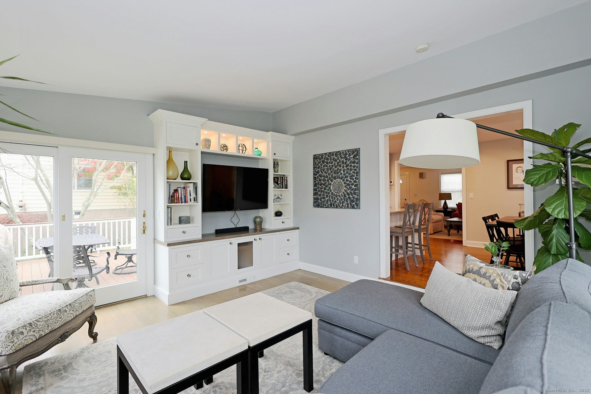 100 Overhill Road Fairfield, CT 06824 - Photo 18 of 40 a living room with furniture a flat screen tv and a large window