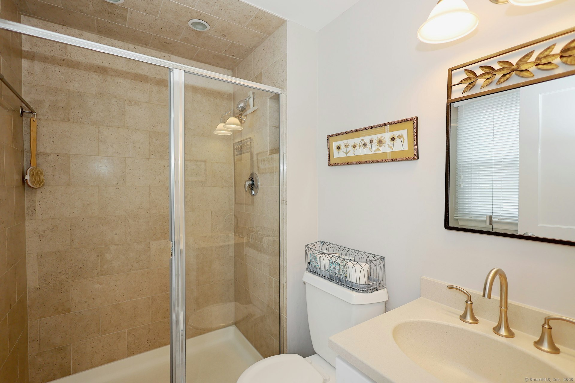 100 Overhill Road Fairfield, CT 06824 - Photo 19 of 40 a bathroom with a toilet sink vanity and shower